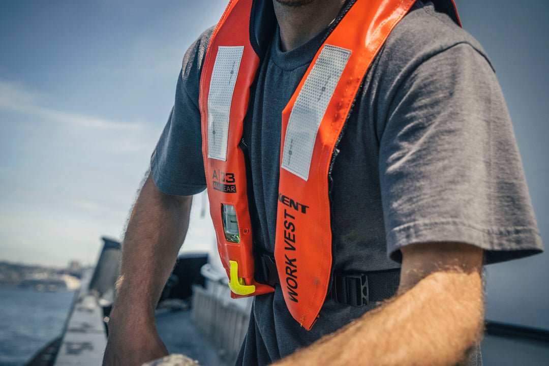Closeup photo of a worker wearing an Orange inflatable Hi-Vis vest from Kent Safety Products.