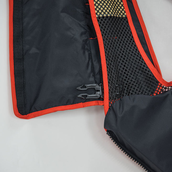 Close-up of a Radio Pocket with mesh, clip, and SOLAS-grade reflective material.