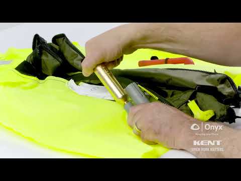 Step-by-step guide on inspecting, rearming, and repacking inflatable life jackets for safety.